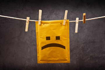 Sad face emoticon on mail Envelope