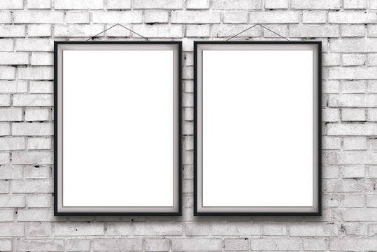 Two blank vertical paintings or posters in black frame