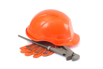 Helmet, gloves and monkey wrench