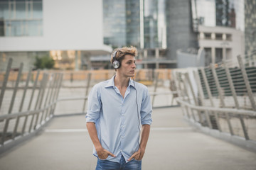 young model hansome blonde man with headphones