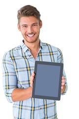 Handsome young man showing his tablet pc