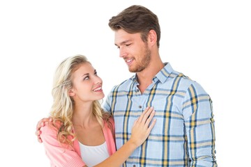 Attractive young couple smiling at each other