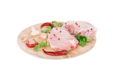 Raw meat on a wooden platter.