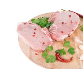 Raw meat on a wooden platter.