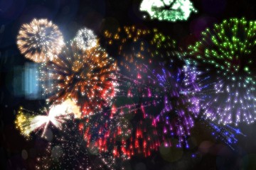Obraz na płótnie Canvas Colourful fireworks exploding on black background