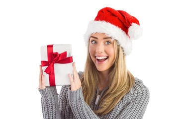 Festive blonde holding christmas gift