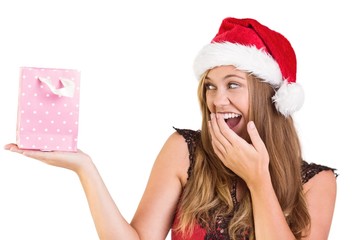 Festive blonde holding a gift bag