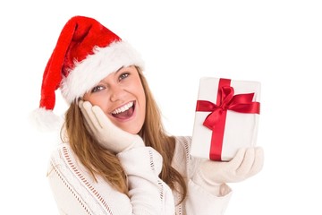 Festive blonde holding a gift