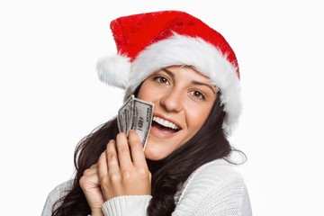 Woman holding money towards herself