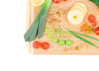 Close up of vegetables on wooden platter.
