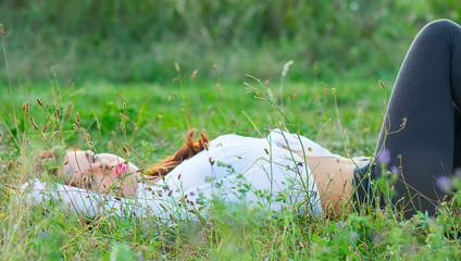 Young woman lying on a field