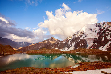 Beautiful mountain lake with reflection of nearest mountains