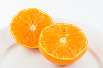 Half orange fruit on white background, fresh and juicy