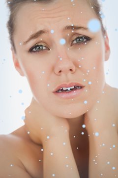 Composite image of woman suffering from neckache