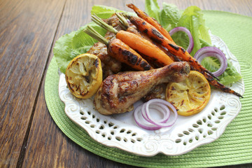 Grilled chicken legs and carrots