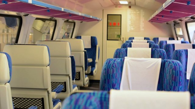 train - interior - seats - first class - door in the background