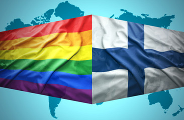 Waving Finnish and Gay flags