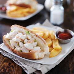 lobster roll with french fries and ketchup