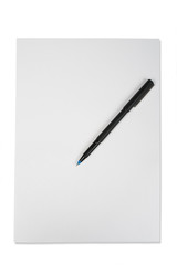 Blank note paper with pen. isolated on white.