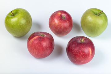 Five apples on a white background.