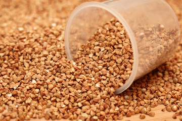 Buckwheat and measuring cup