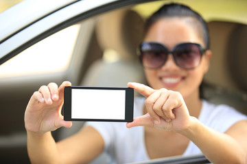 woman driver sit in car hold one blank smart phone