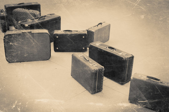 group of vintage suitcase on tiled floor, retro stylized
