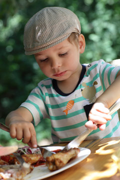 Child Eating Chicken