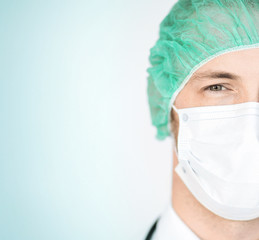 surgeon in medical cap and mask