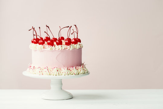 Cake decorated with maraschino cherries