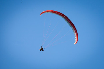 Paraglider in a blue sky