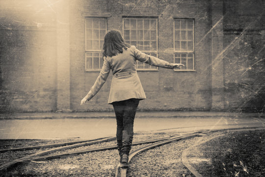 girl walking on the railway, retro stylized photo