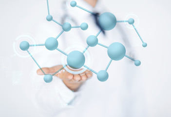 close up of male doctor hand with molecules