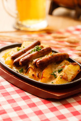 roasted potatoes with sausage in the bar