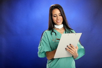 Fototapeta premium Young doctor takes notes
