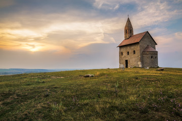 Fototapeta na wymiar Old Roman Church at Sunset in Drazovce, Slovakia