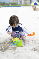 Happy Child Playing On The Beach