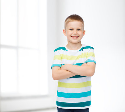little boy in casual clothes with arms crossed