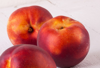 Three tasty fresh ripe juicy nectarines