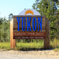 Sign welcoming visitors to Yukon Territory, Canada - 69697224