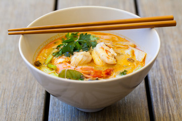 Bowl of traditional Thai tom yam soup