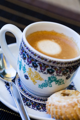 Cup of freshly brewed tea and a cookie