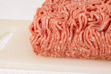 Block of commercial beef mince from a store