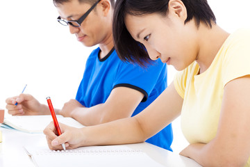 two young students learning together in classroom