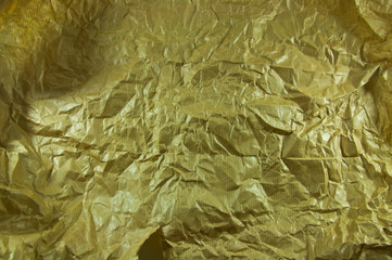 Gold Paper creased and folded to provide a textured background