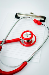 Stethoscope with plastic clipboard , blank paper and pen