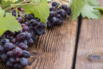 Blue Grapes (on wooden background)