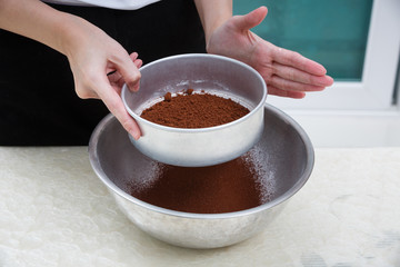 sifting cocoa powder