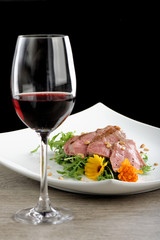 Tagliata roast beef on rocket salad