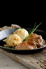 Fried pork chop with sauce and mashed potato